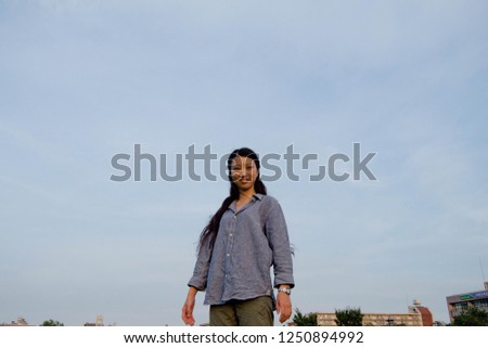 Asian female model poses for pictures in the nature