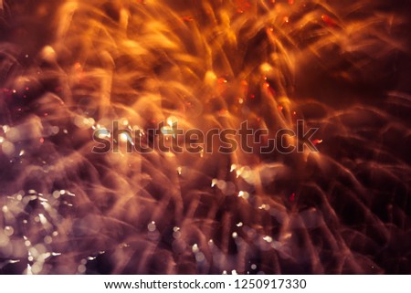 A beautiful, abstract artistic image of New Year Eve fireworks. Colorful picture with blur and lights.  Festive background image.