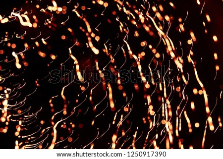 A beautiful, abstract artistic image of New Year Eve fireworks. Colorful picture with blur and lights.  Festive background image.