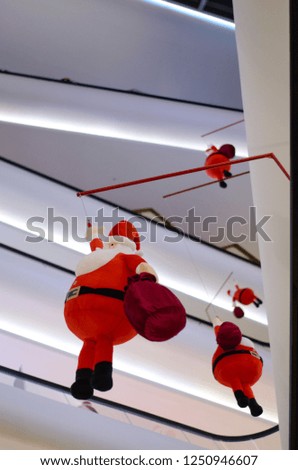 Santa Claus doll decorates in Shopping mall for Christmas Holiday.