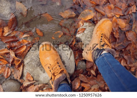 Feet on the rocks near the river               