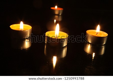 burning candles on a dark background