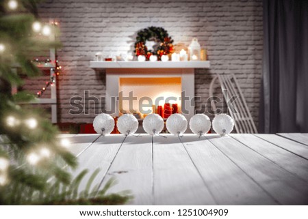 White wooden old table with free space for your decoration and fireplace in home interior 