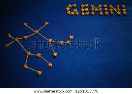 Yellow stars lined constellation and the inscription Gemini. Astrology, zodiac signs. Vignetting, drawing made by the author.