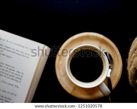 Flat lay copy space on coffee cup with book