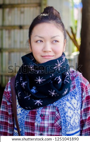 Asian female model poses for pictures in the street