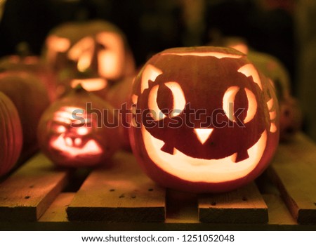 Illuminated figures made of pumpkins. Helloween night.