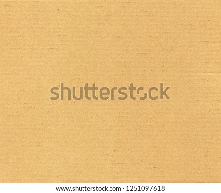 brown cardboard texture useful as a background, soft pastel colour Royalty-Free Stock Photo #1251097618