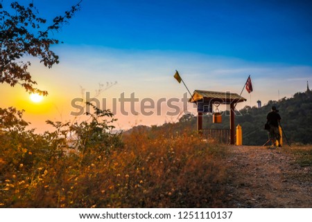 Thai temple on the hill, Man Taking photo At the top of  mountain, landmark in Thailand