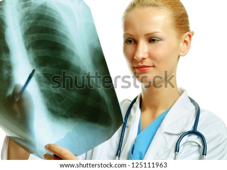 A female doctor examining an X-ray picture