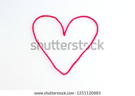 Simple Single Red Heart from Yarn on White Background, Love, Valentine's Day Royalty-Free Stock Photo #1251120883