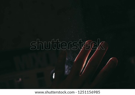 hands front of light rays