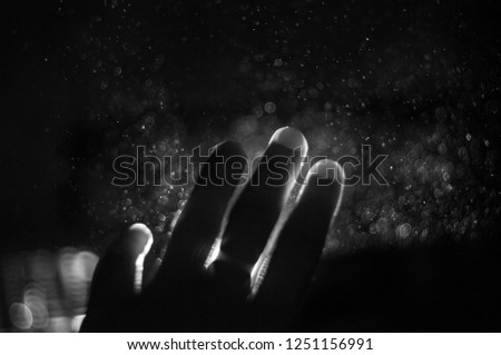 hands front of light rays