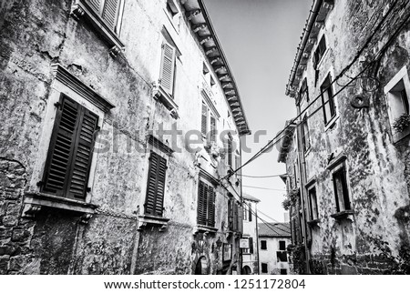 Historical buildings in Groznjan, Istria, Croatia. Architectural scene. Travel destination. Black and white photo.