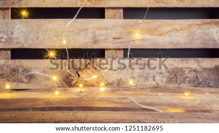 Wooden table and yellow spotlight. Background photo with place for text.