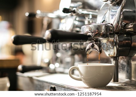 Coffee on  espresso machine  Royalty-Free Stock Photo #1251187954