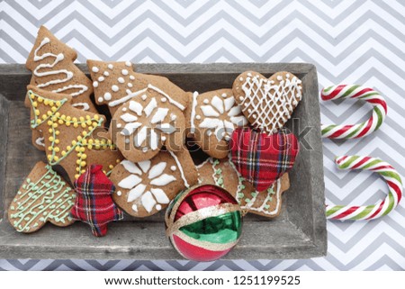 New Year or Christmas background. Spicy gingerbread cookies and decorative items.
