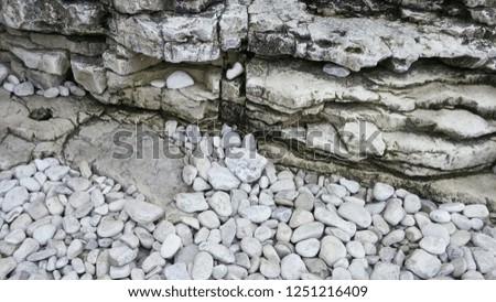 This is an image of rocks at the sea shore of the great lakes