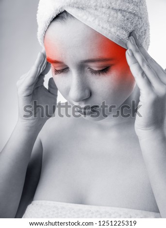 Woman with headache. Medical concept. Black and white photo