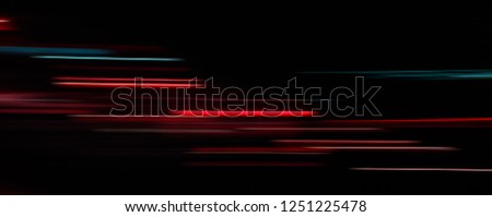 Abstract light trails in the dark background  motion blur Royalty-Free Stock Photo #1251225478