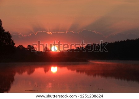 Beautiful pink sunrise on the lake.