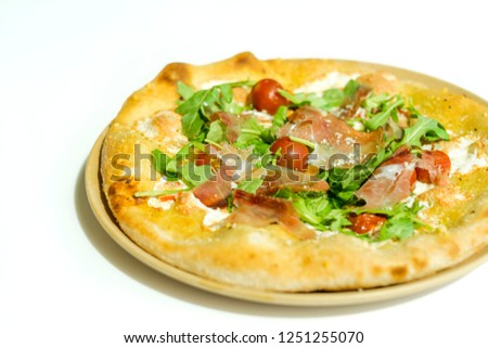 Delicious Artisanal Pizza Topped with Fresh Tomatoes Cheese and Prosciutto Isolated on White Background 