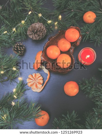 Mandarin or clemetine flat lay composition for christmas. Natural christmas decorations. Food photography. Fresh winter still life composition with clementines for christmas