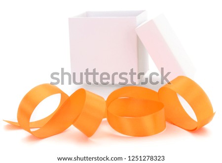 White gift box with golden ribbon isolated on white color background