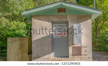Building with Chlorinator Plant No Trespassing sign