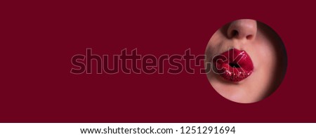 View of beautiful red lips giving kiss through hole in paper background. Make up artist, beauty concept. Ready to new year party. Cosmetics sale. Beauty salon advertising banner with copy space.