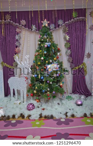 Winter holiday concept, decorated Christmas tree in the interior of photography . New Year background to take photo