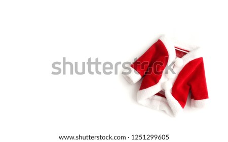 Christmas background Santa Claus (Saint Nicholas) red mini coat suit costume white cuffs flat lay isolated on white background. Concept photo for Merry Christmas Winter holidays celebration.