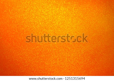 Vintage texture of yellow orange wall for design backdrop. Concrete walls in paint splashes. Illuminated surface. Bright background. Raster image.