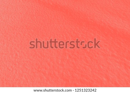 Modern luxury background or mock up with space for text. Fresh snow texture in color of the year 2019 Living Coral pantone