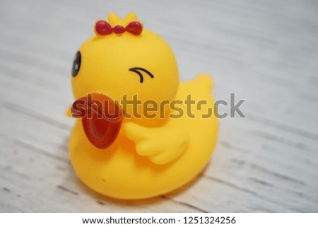 Yellow rubber duck isolated on white background. Selective focus. 