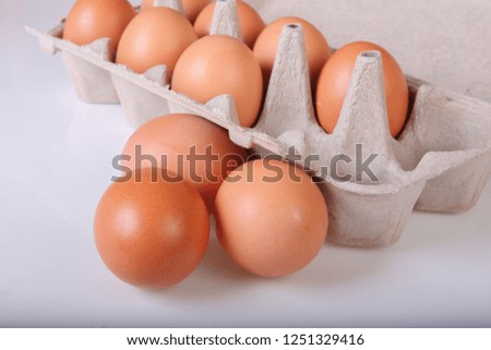 A box of chicken eggs. Closeup. Isolated.