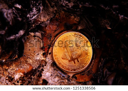 gold bitcoin coin ashes
