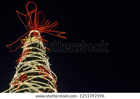The colorful neon lights Christmas tree in Bangkok, Thailand.