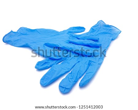 Blue surgical glove isolated on white background Royalty-Free Stock Photo #1251412003