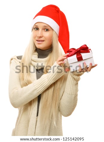 Christmas woman holding gift wearing Santa hat. Isolated on white background.
