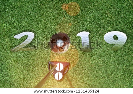 incoming year 2019, prepare by putting of golfer on the green,  golfball is ready dropped in hole of new year success, Happy new year and merry Christmas on golf course
