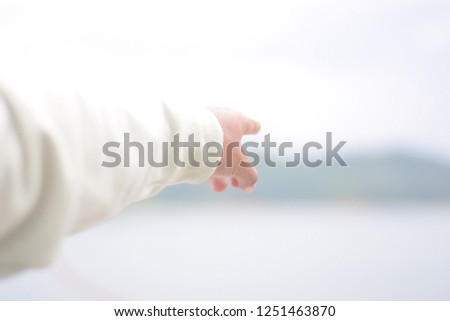 close up young men pointing his finger to forward and blur background