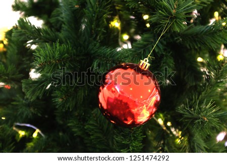 close up of beautiful Christmas tree decorated with red and silver balls and Christmas space for text