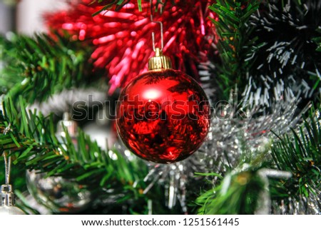 Christmas balls in various of colors and other holiday ornaments. Winter holiday decoration for Christmas and new year.