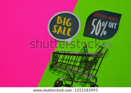 Big Sale and Special Offer 50% Off Text and Shopping cart. Discount and promotion business concept on colorful background
