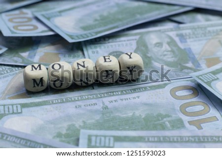 The money word on wood brick  background banknote.