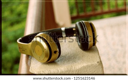 Yellow headphones on white background