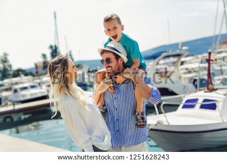 Happy family having fun, enjoying the summer time by the sea. Royalty-Free Stock Photo #1251628243