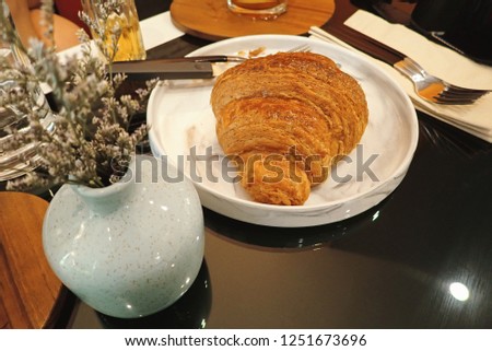 Fresh Croissants on table in morning.