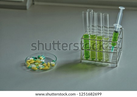syringe, drug, equipment and glassware in scientific experiment laboratory